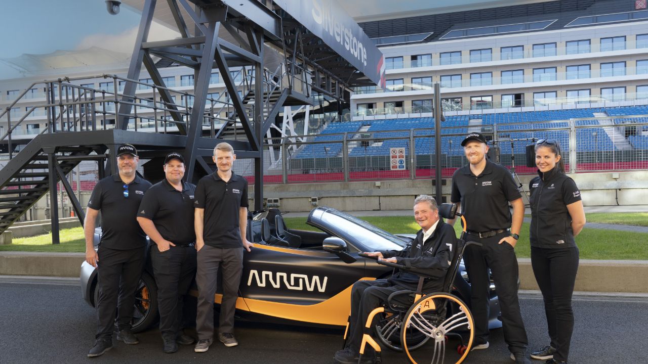 Sam Schmidt and the Arrow SAM Car team at the race track.