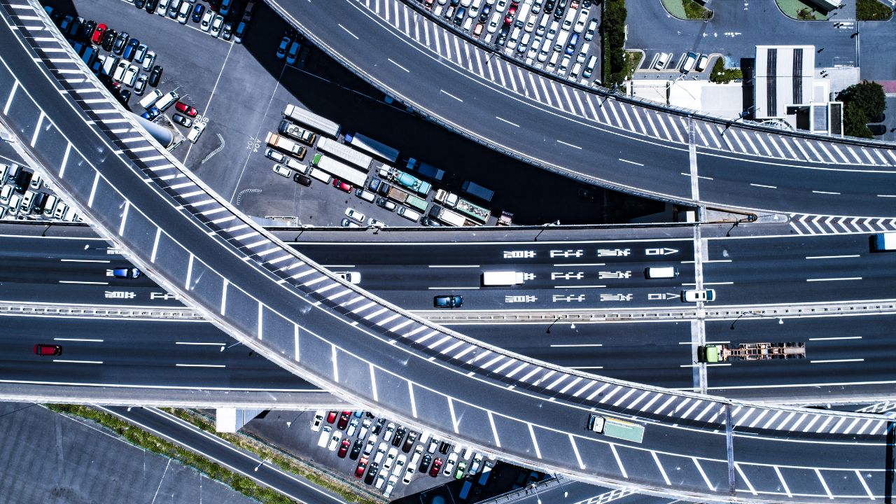 Aerial view of intersection and crowded car slots