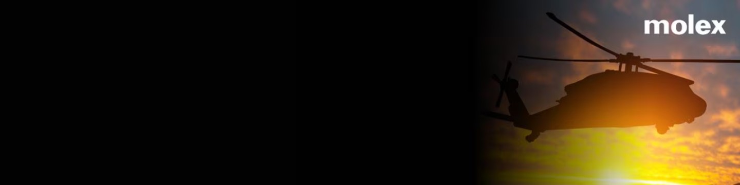 헬리콥터가 활기찬 노을을 배경으로 실루엣으로 보이며, 오른쪽 위 모서리에 'molex'라는 단어가 명확하게 보입니다.