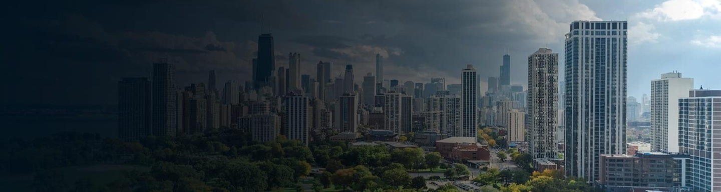 A striking cityscape featuring tall skyscrapers under a dramatic sky