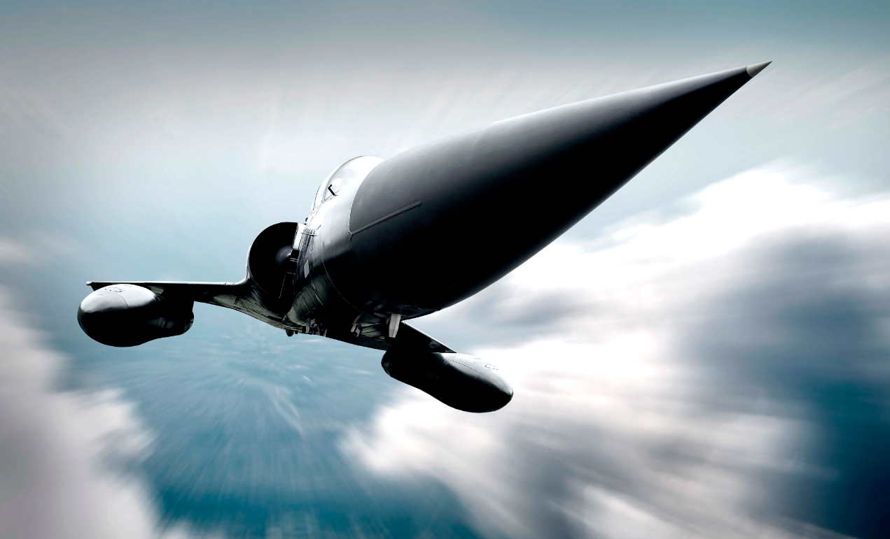 A sleek, pointed jet aircraft is captured soaring at high speed above a layer of clouds. 