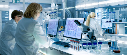 Female and Male Scientists Working in Laboratory