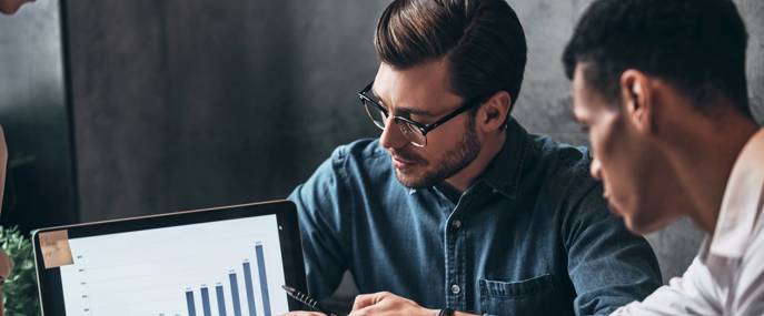 Young business people analyzing sales