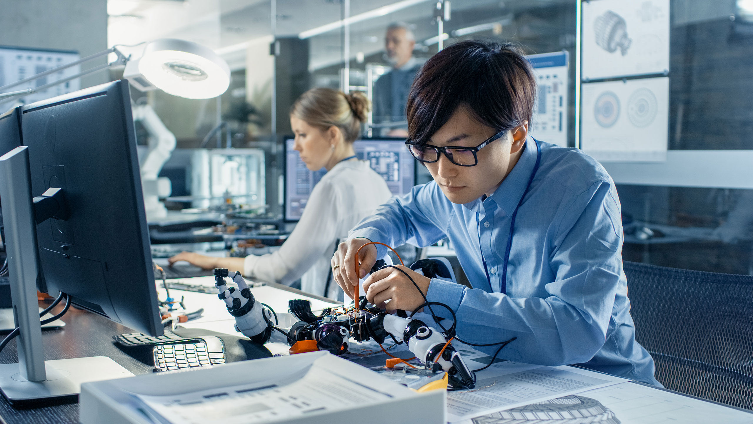 Electronics_Engineer_Works_with_Robot