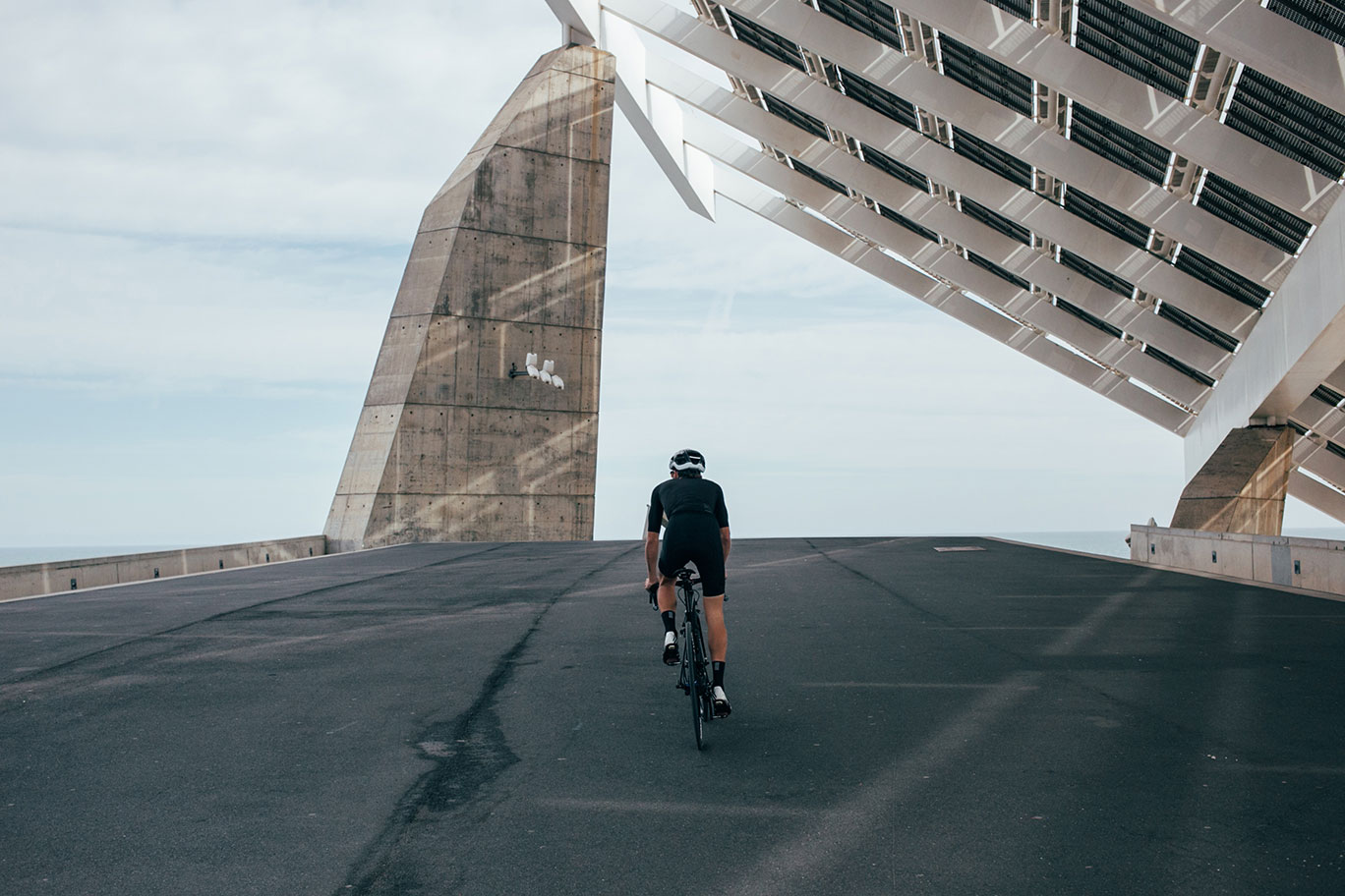 Man_Riding_Bike_on_Walkway